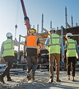 Construction crew walks together on a job site