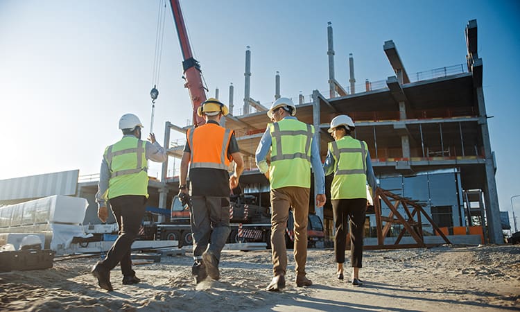 Construction crew walks together on a project site